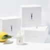 en citron, en flaske lotion og en kasse lotion.