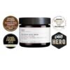 Krukke med Evolve Daily Skin Essentials Trio ansigtscreme til normal til tør hud omgivet af prismærker, der angiver dens udmærkelser.
