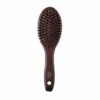 John Masters Organics Combo Paddle Brush - Mini er en brun hårbørste med et ovalt hoved og børstehår, med et hul i håndtaget til ophængning.